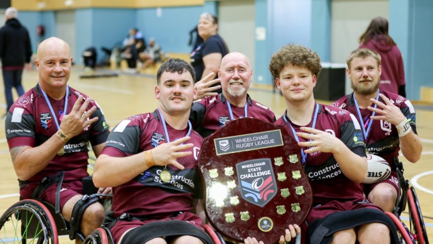 Queensland Wheelchair Maroons Team Members Holding Up State Challenge Shield